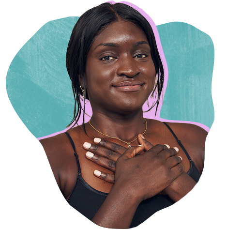 Young Black woman with soft kind smile and hands folded over hear heart